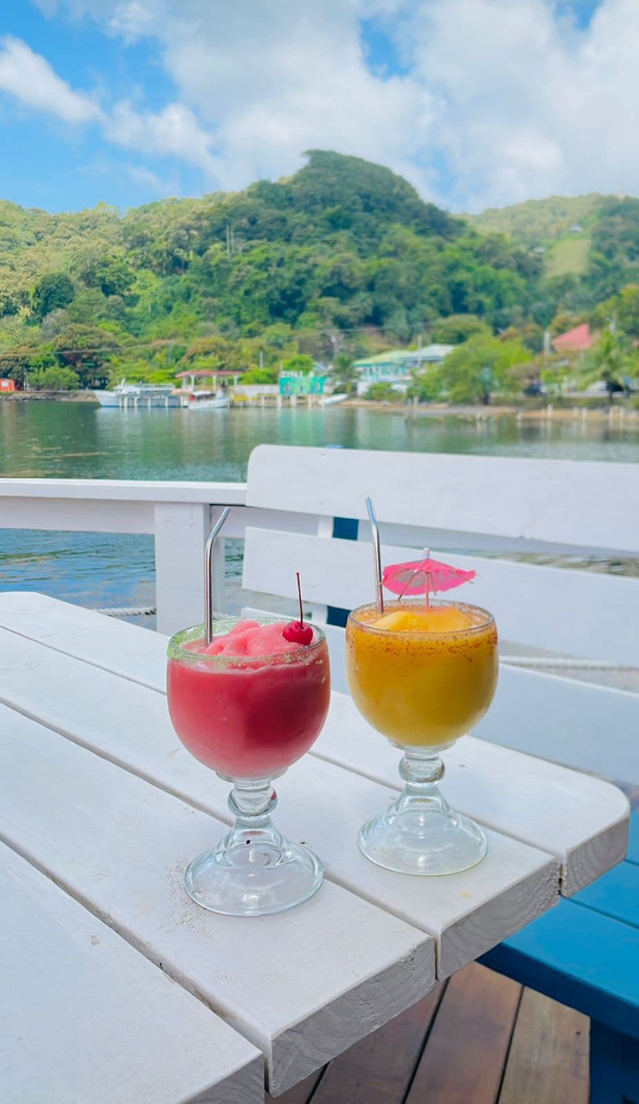 Fresh tropical cocktails with a view of the Roatan hills and harbor